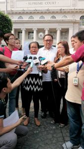 Harry Roque and the family of the murdered victim at the Philippine Supreme Court
