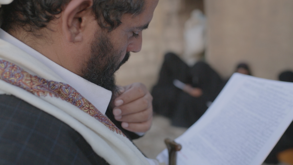 Mohammed Ghazy, Fahd’s older brother, at the Ghazy home in 2013, reading a letter Fahd sent from Guantanamo