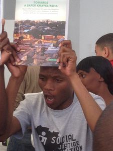 Khayelitsha residents celebrate at the release of the Commission report on 25 August 2014, picture: SJC