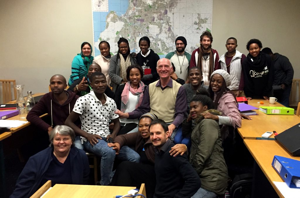 Participants of the course get together for a photo with Justice Edwin Cameron (centre) after his session on South Africa's Constitution.