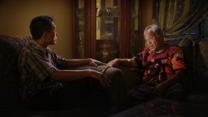 Adi questions Commander Amir Siahaan, one of the death squad leaders responsible for his brother’s death during the Indonesian genocide, in Joshua Oppenheimer’s documentary The Look of Silence. Courtesy of Drafthouse Films and Participant Media.