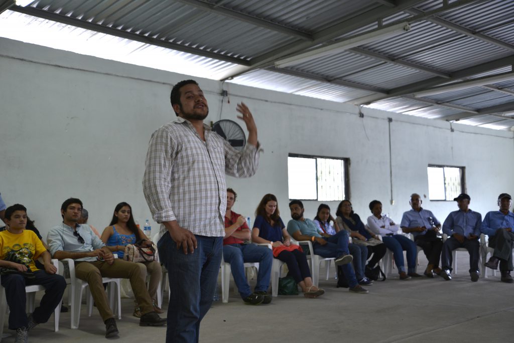 A community member speaks to educational exchange participants in Mexico